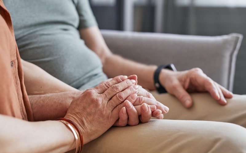 caring-senior-couple-closeup of hands